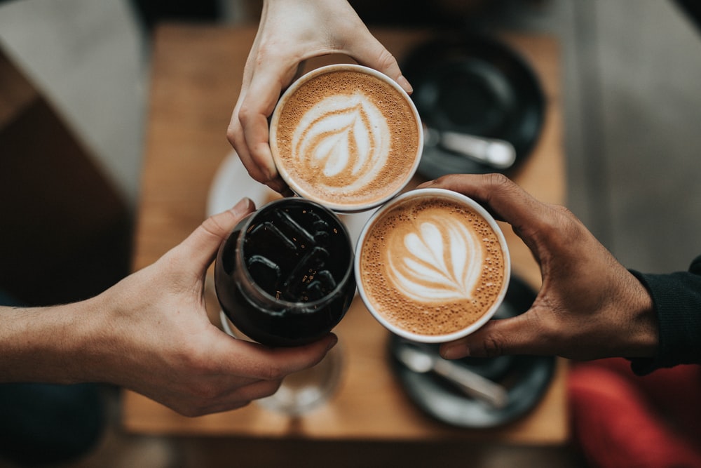 A group of people drinking coffee